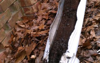 Roots can grow up the downspouts if they are not properly cleaned causing massive clogs. These downspouts have to be replaced.