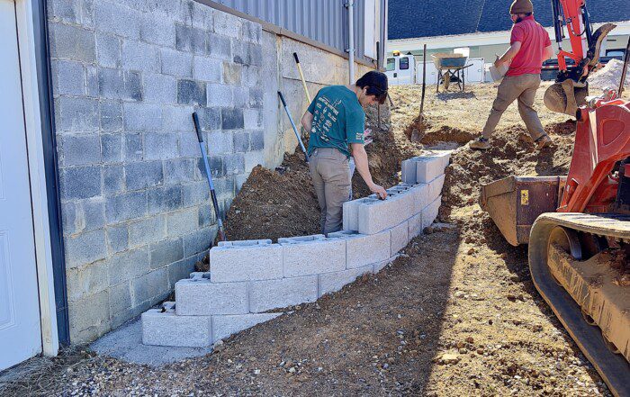 French drain, concrete, retaining walls, and drainage work