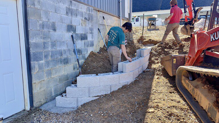 French drain, concrete, retaining walls, and drainage work